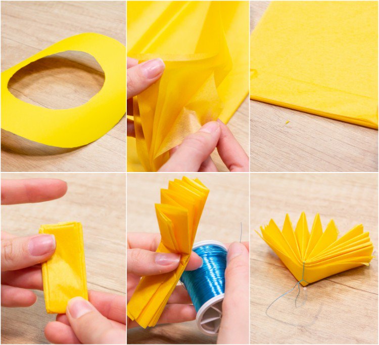 ziehharmonikafalten aus papier formen und mit draht binden gelber ring ausschneiden