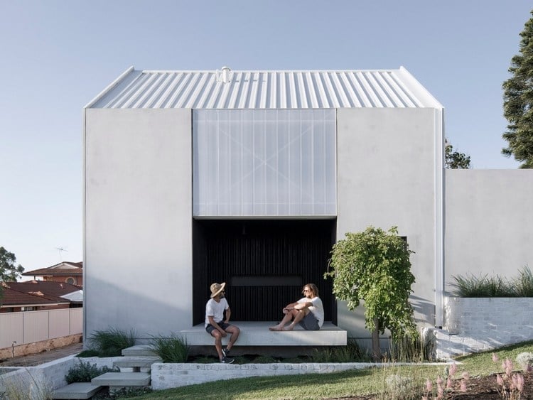 haus mit betonwänden mit nachhaltigem design und minimalistischen formen in grau