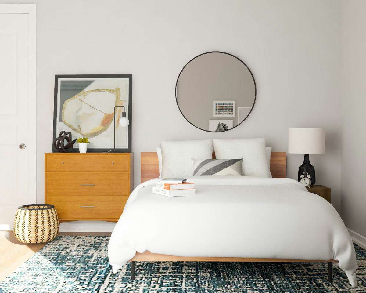 12 qm Zimmer einrichten mit Bett, Teppich, Kommode und rundem Spiegel