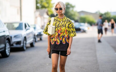 schwarze Radlerhose kombinieren Neonfarben Oversized T-Shirt hellblonde Haare Sonnenbrille Retro