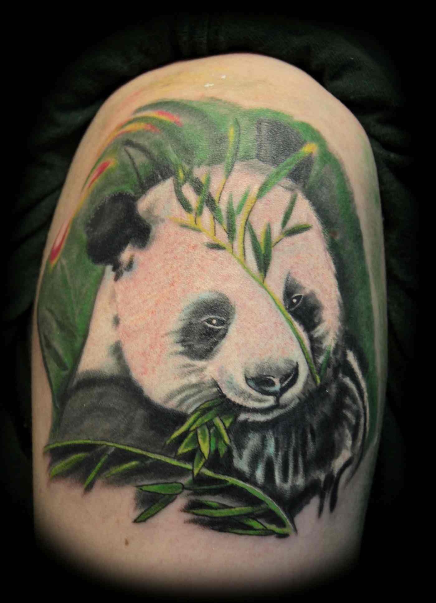 Combine the white panda with bamboo for a green tattoo