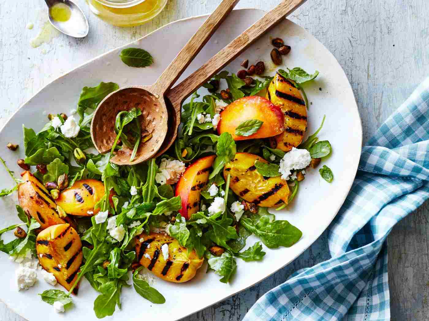 Grilled salad for summer with grilled sausage, rocket, fat and honey