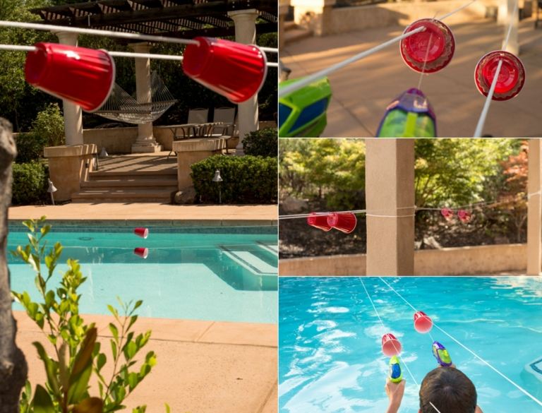 Poolparty zum Kindergeburtstag mit passenden Spielen planen - Becher schießen mit Wasserpistole