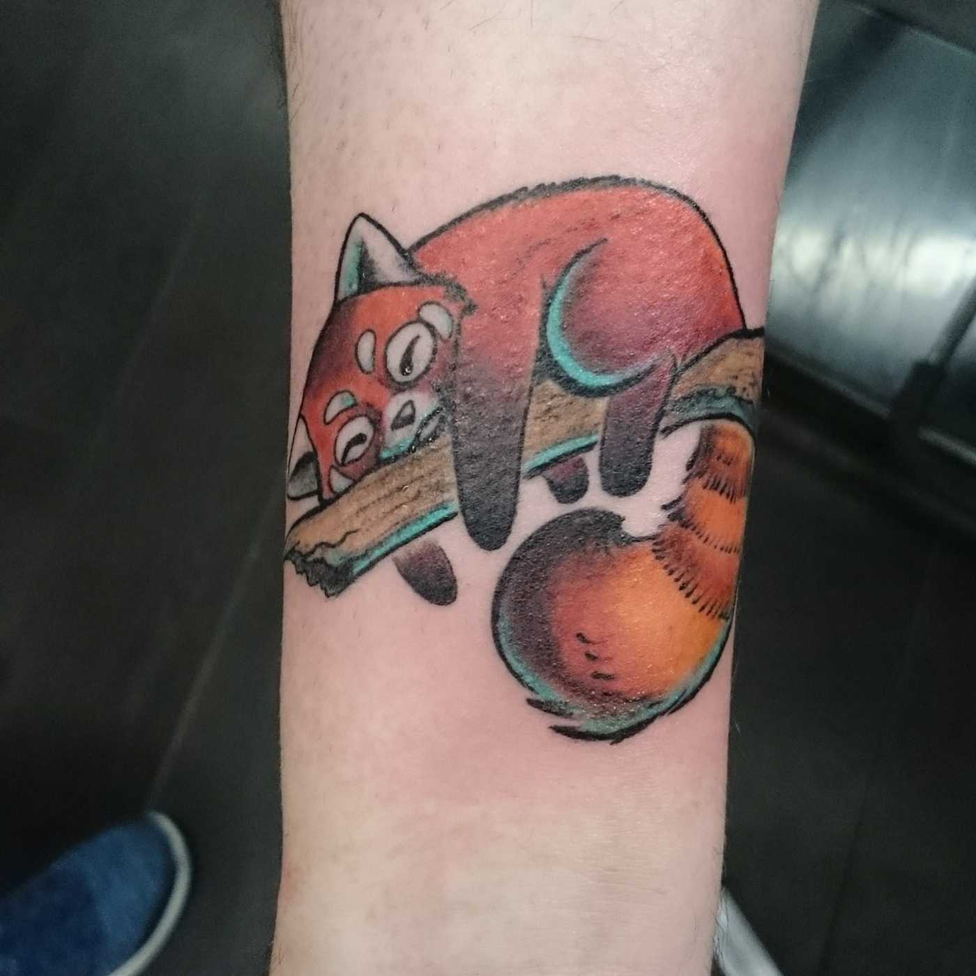 Rotate Panda Tattoo in Orange on one Asthma for the lower arm