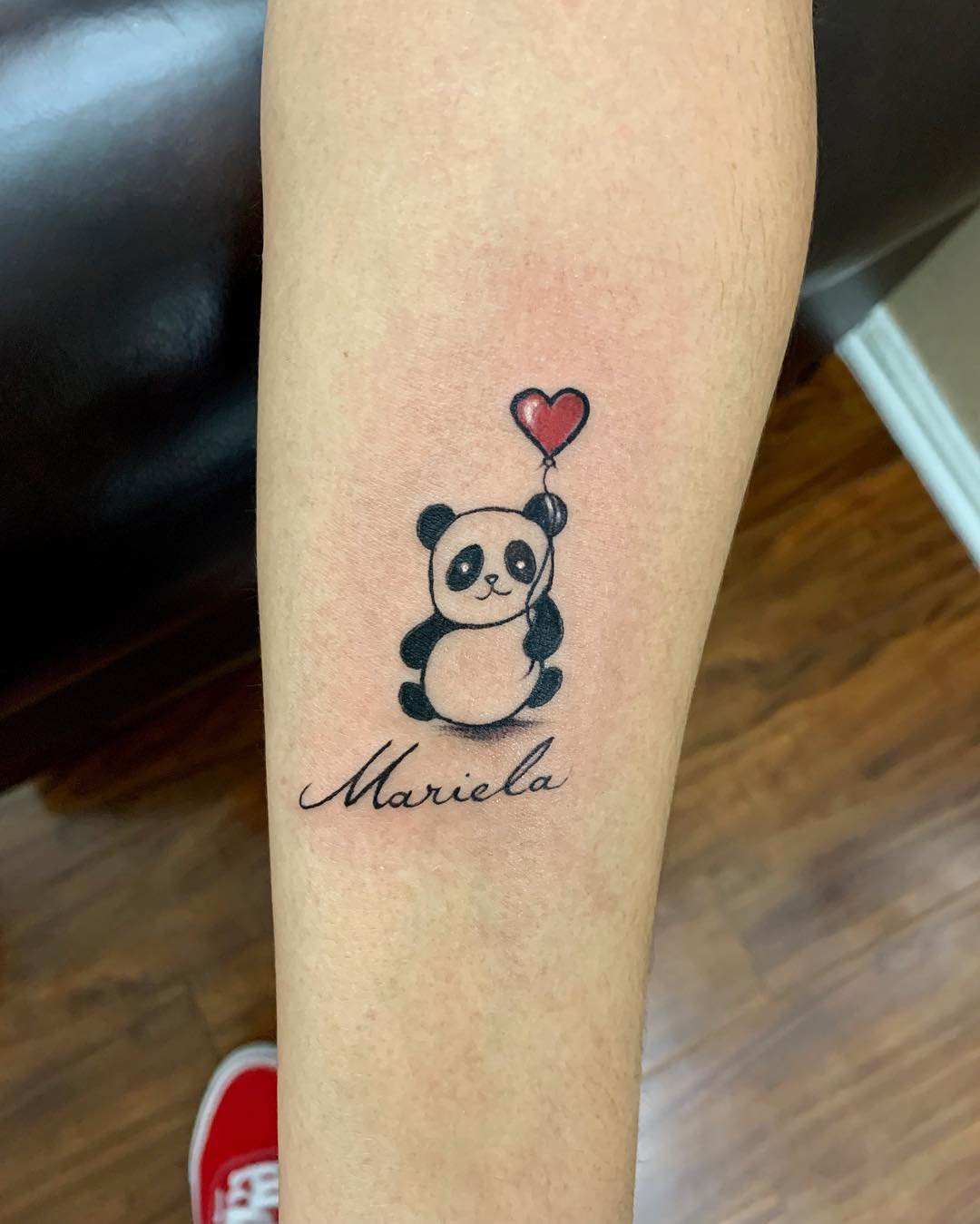 Black-and-white panda with rotor air balloon in shape and name as scripture