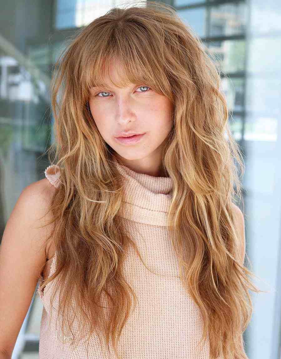 Shag Frisur with long hairs Dark blonde with straight curtain bangs