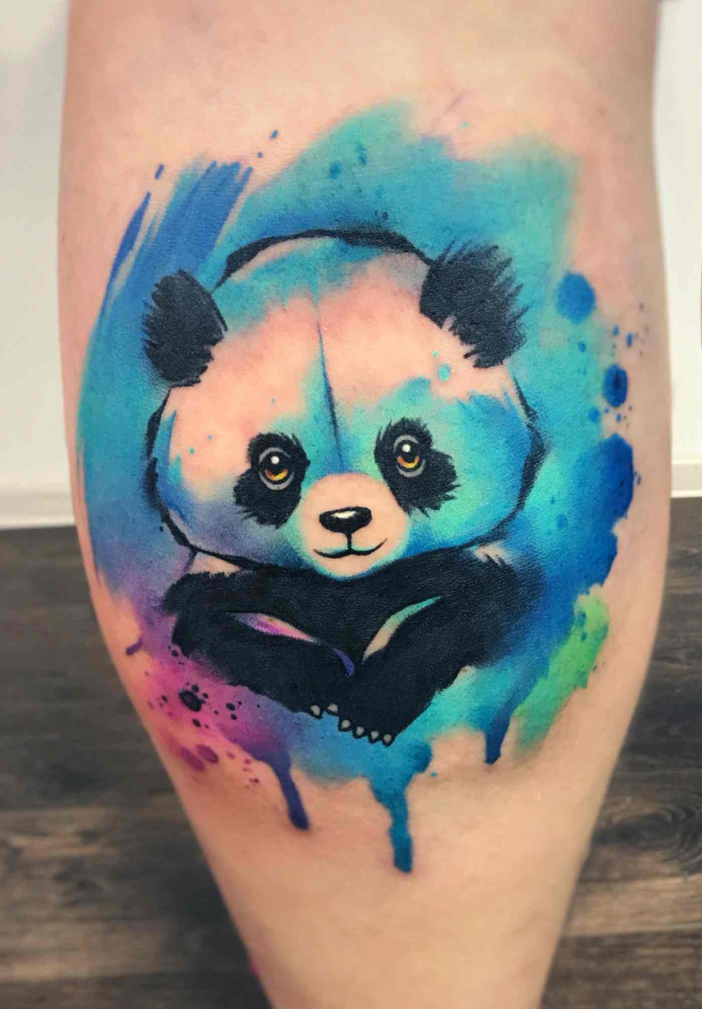 Wading Tattoo with attractive panda and watercolor colors in blue, pink, purple and green