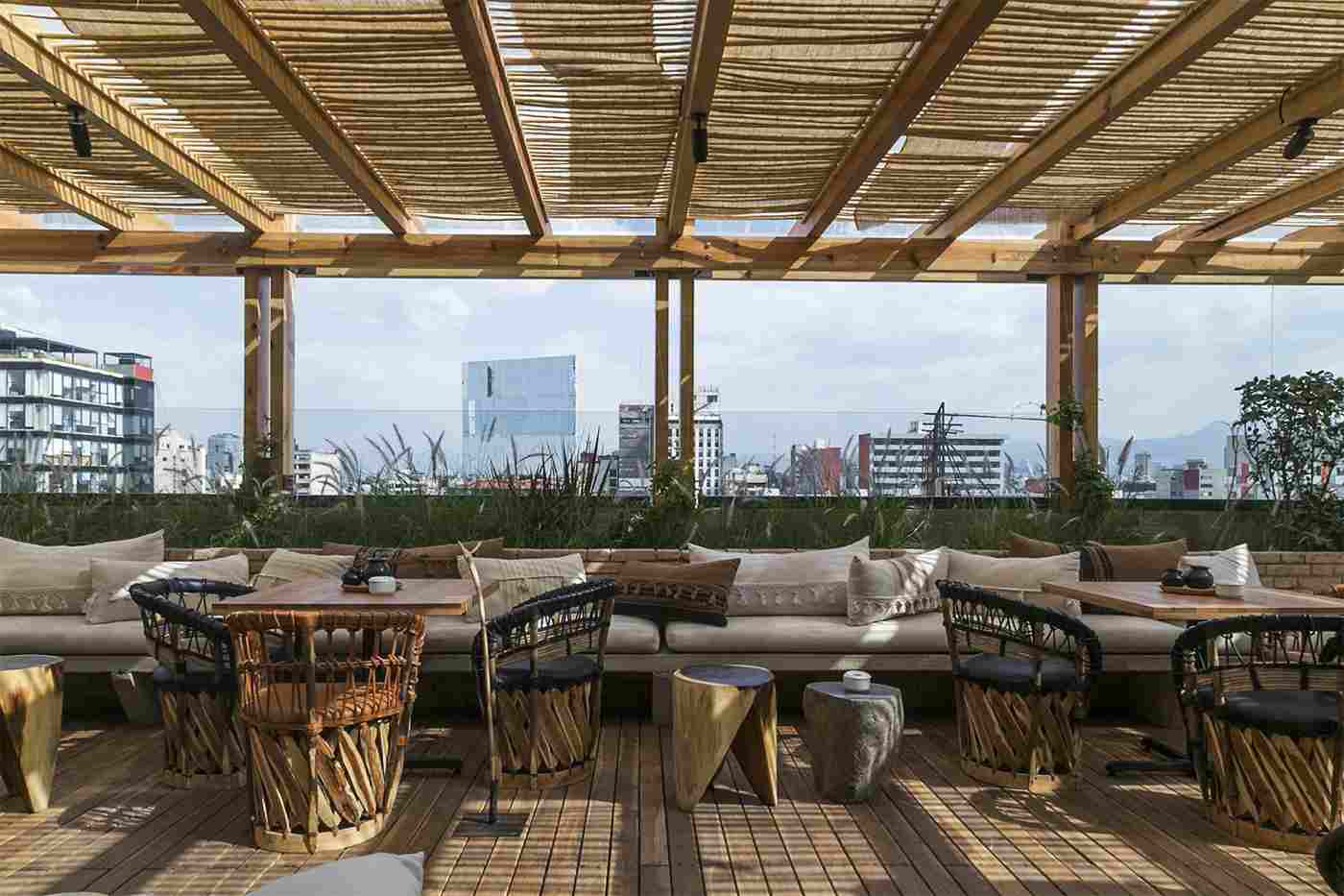 Rooftop deck chairs and wooden pergola tile floor