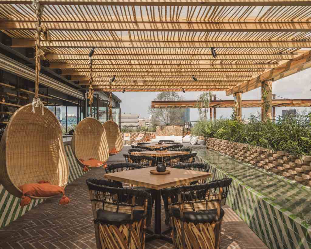 Bar stools and wooden hanging chair roof terrace exotically designed bar