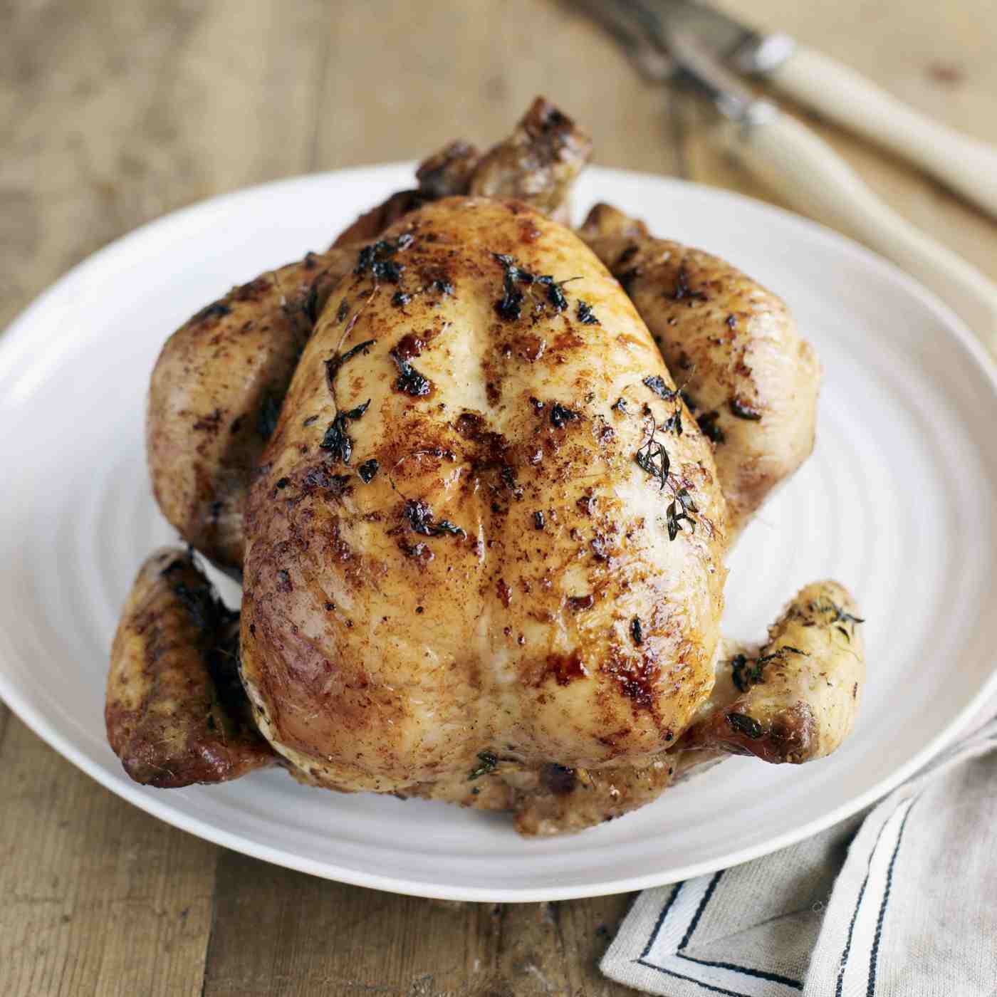 Baked chicken in the oven with fresh spices and pressed lemon juice