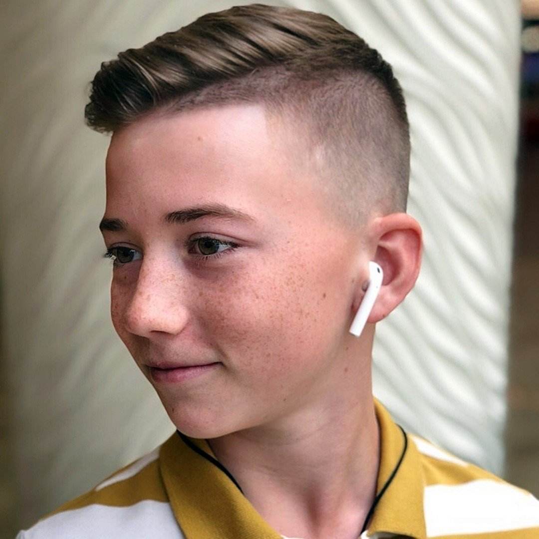 Modern variant of an Iroquois hair cut for a boy