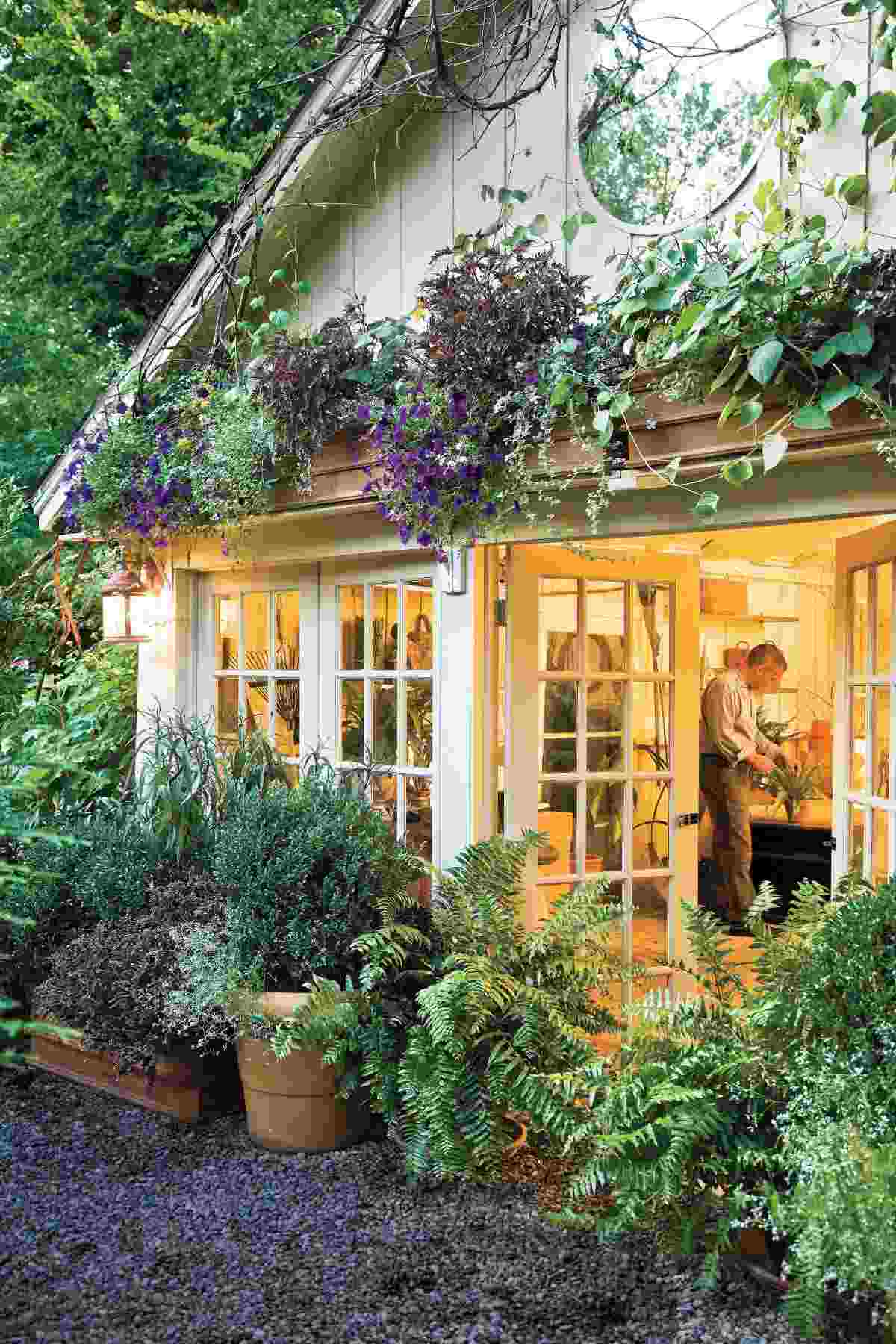 blend outdoor structures in the garden with hanging plants