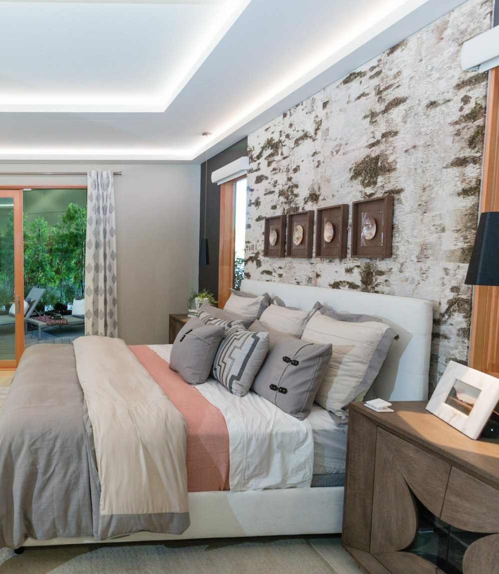cozy bedroom in bright color tones and rustic accent walls