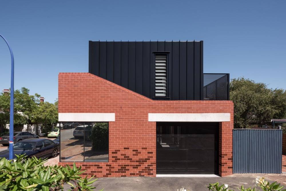 renovate a brick facade and modern metal monumental house