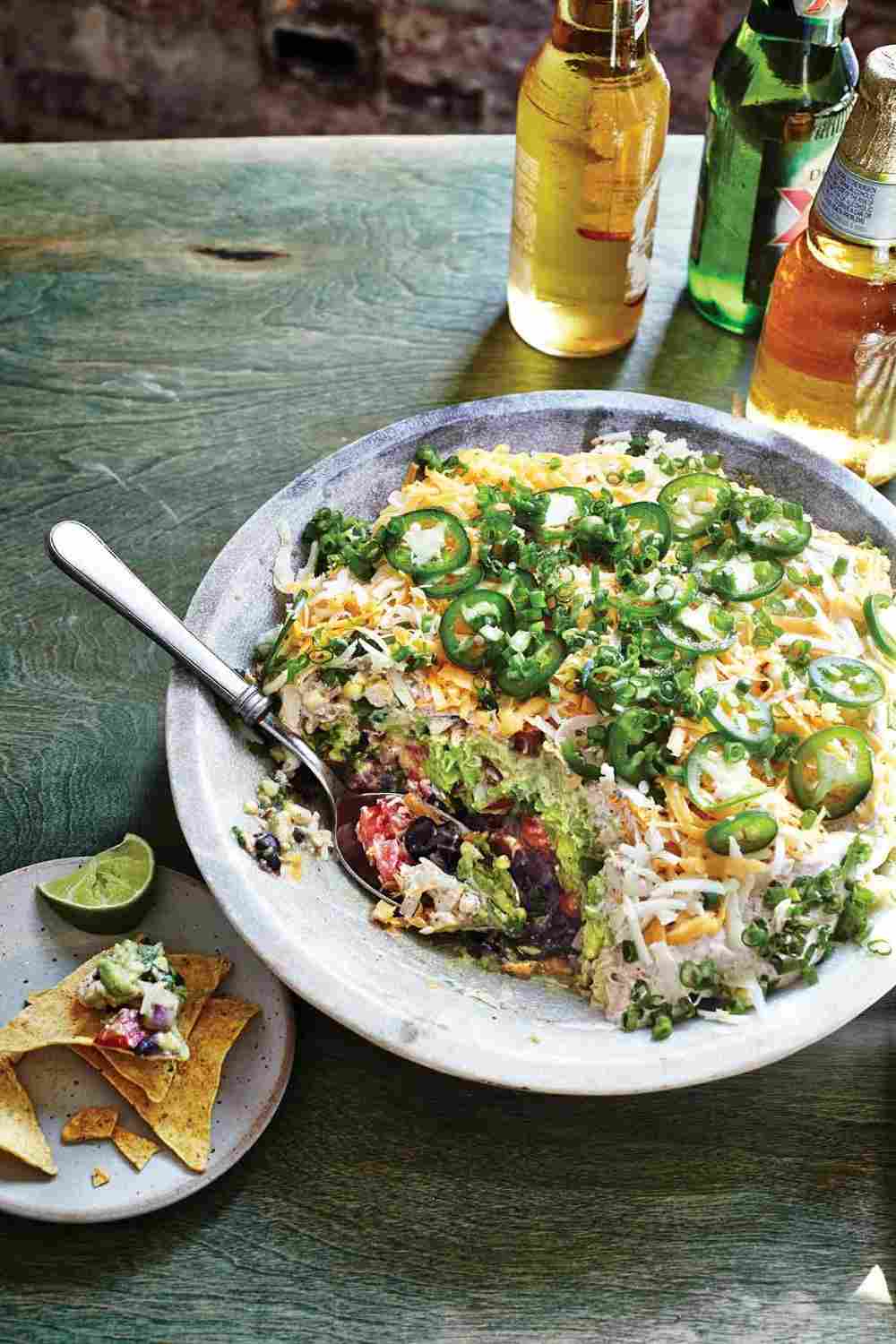 jalapeno on mexican layer salad with grated cheddar cheese and tortilla