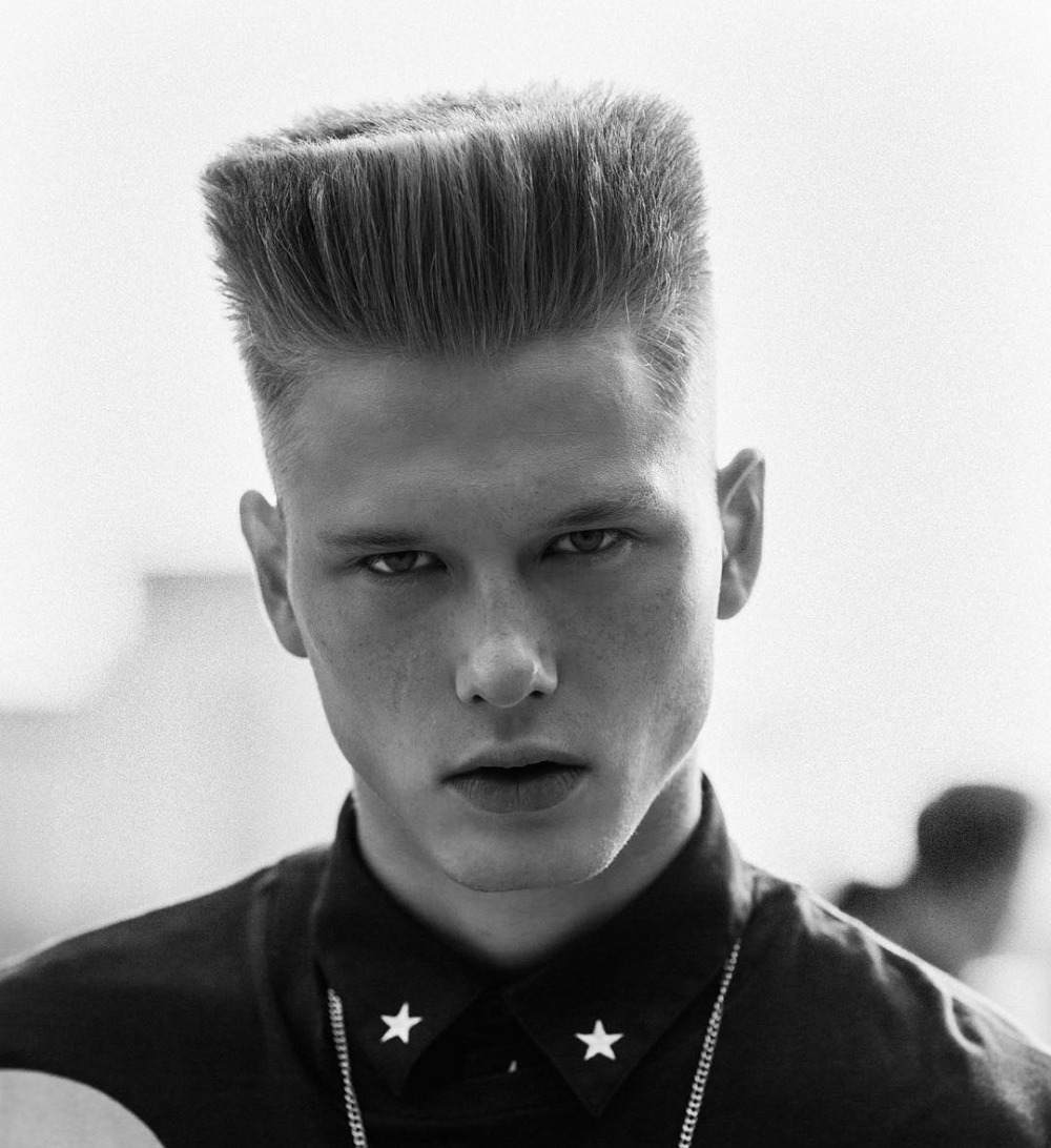classic long boxer cut with high top styled with gel pomade or hair paint
