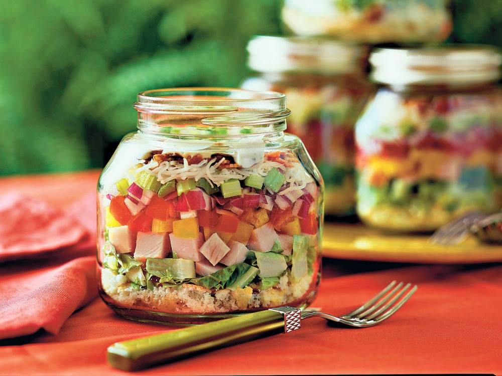 mexican layer salad in glass served with bell pepper and ham diced bunch and delicious
