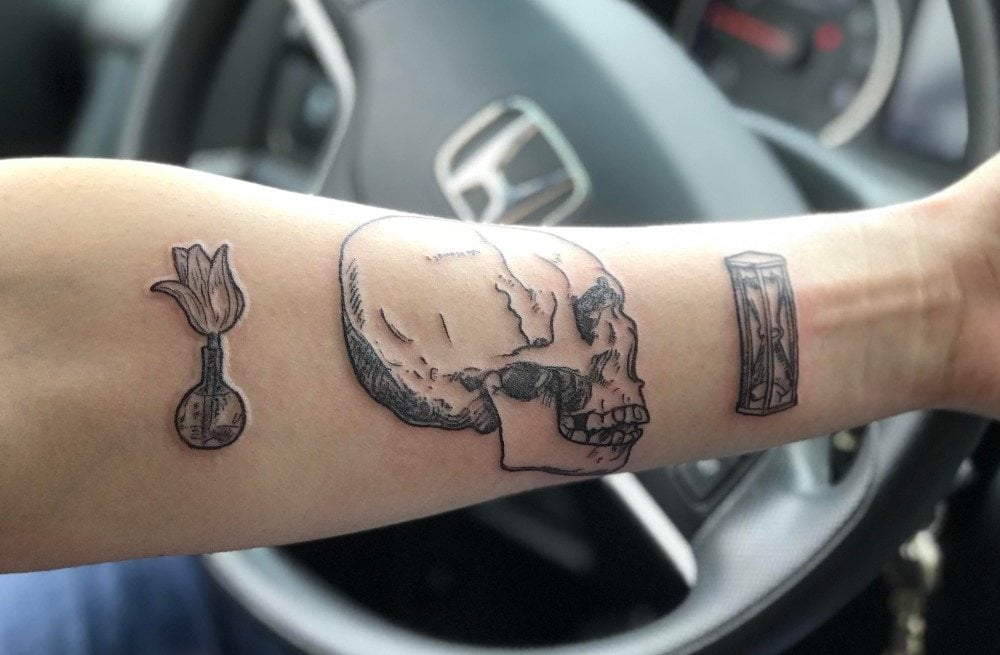 tottenkopf tattoo combining an arm as small tattoos men in the car
