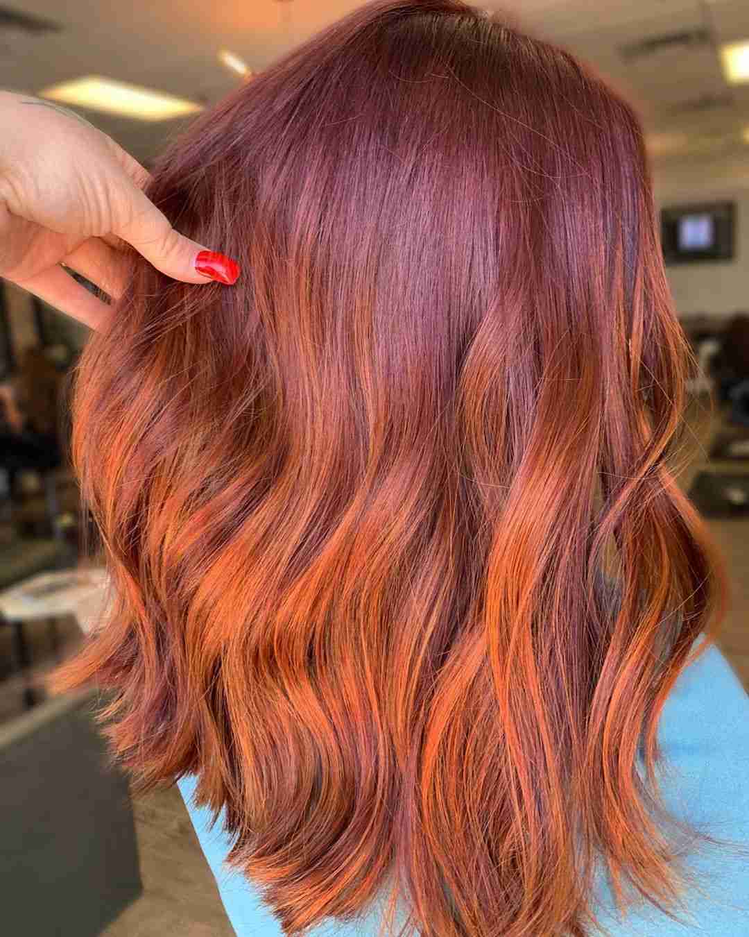 Balayage red caramel copper strands on brown hair