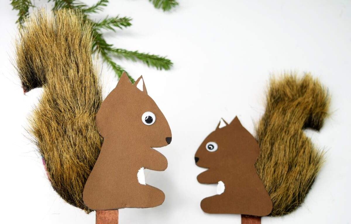Decorate squirrels made of artificial fur and colored paper with wobbly eyes