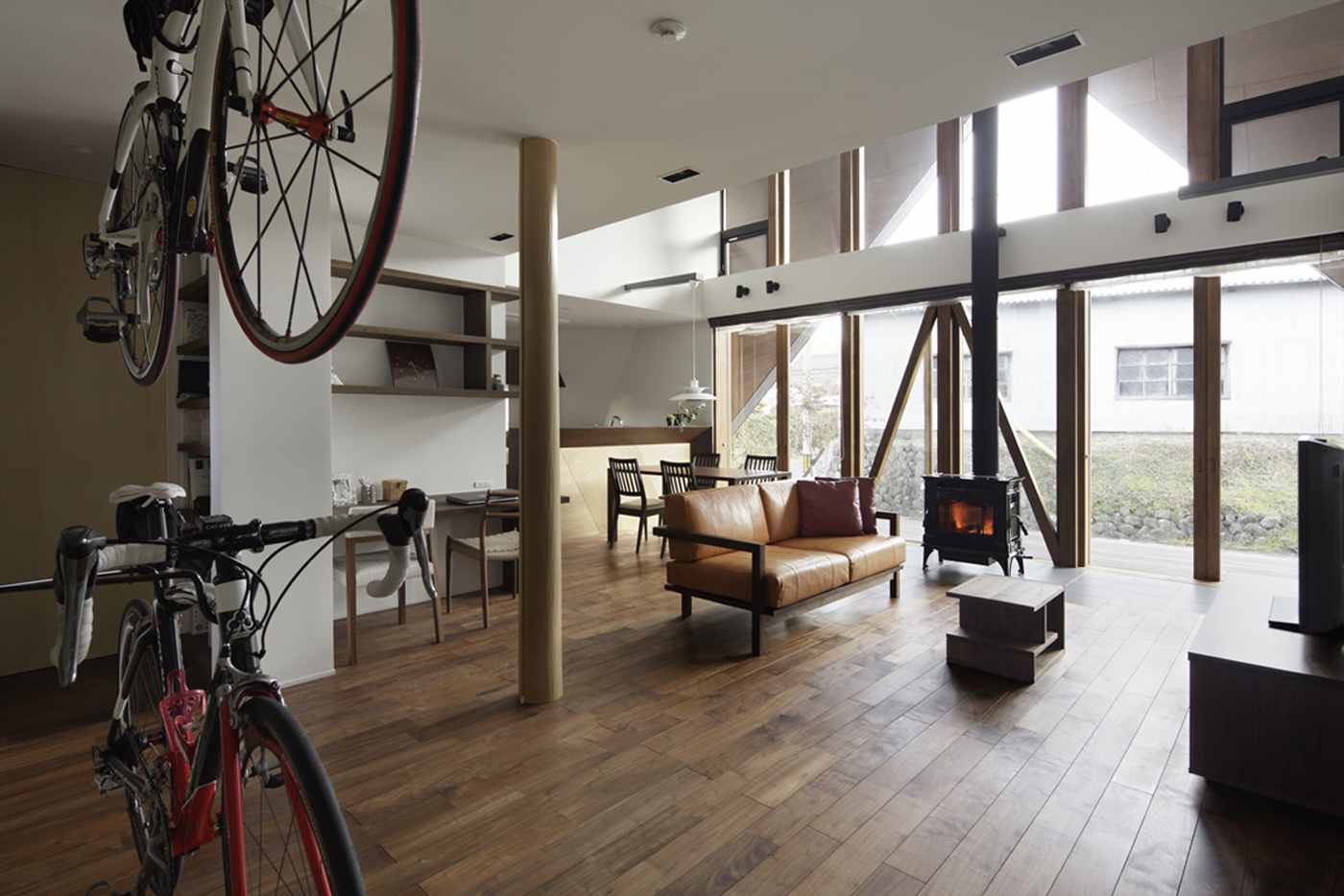 Living area with storage room for bicycles and modern furnishings in Scandinavian style