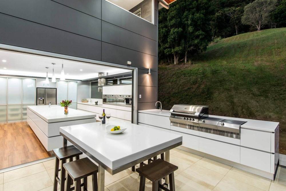 outdoor kitchen built and designed with gas grill aesthetically in white modern kitchen design