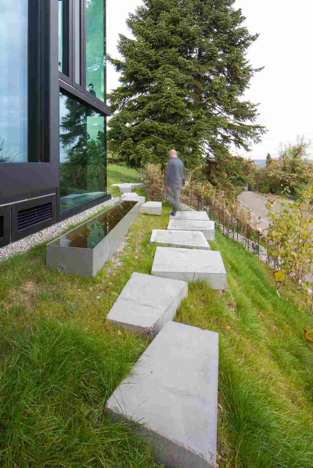 concrete block hanging next to modern house ideas for garden path