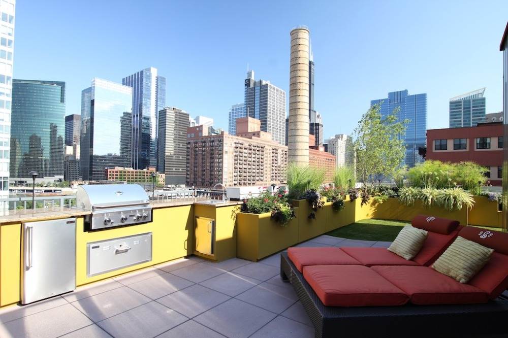 colorful urban roof terrace with outdoor kitchen for cityscape