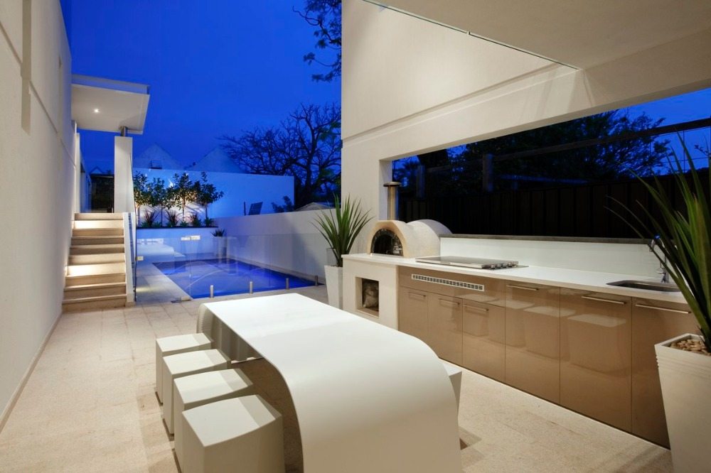 luxurious kitchen set in beige with pizza oven and designer table in white side pool