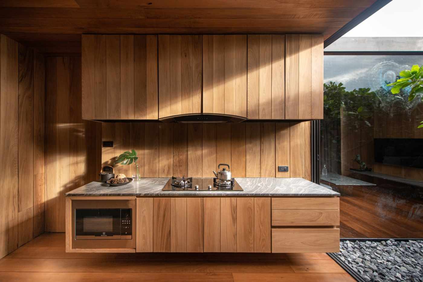 modern built-in kitchen made of wood materials and kitchen appliances