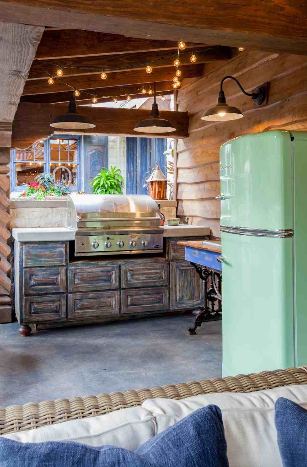 vintage look garden furniture and retro style refrigerator in green combine for rustic atmosphere