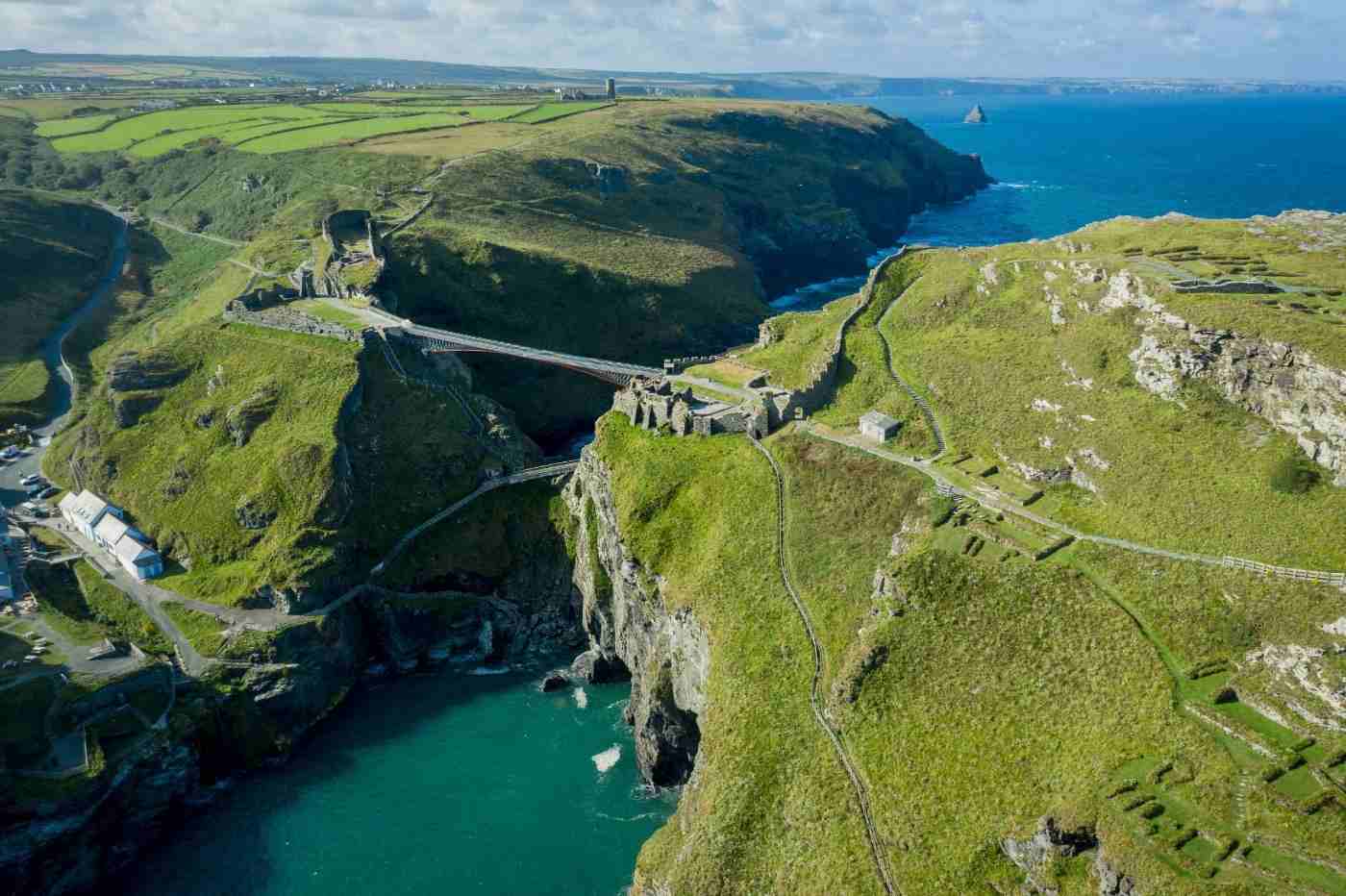 bird's eye view of cornwall locality tintagel close with green area and hanging bridge