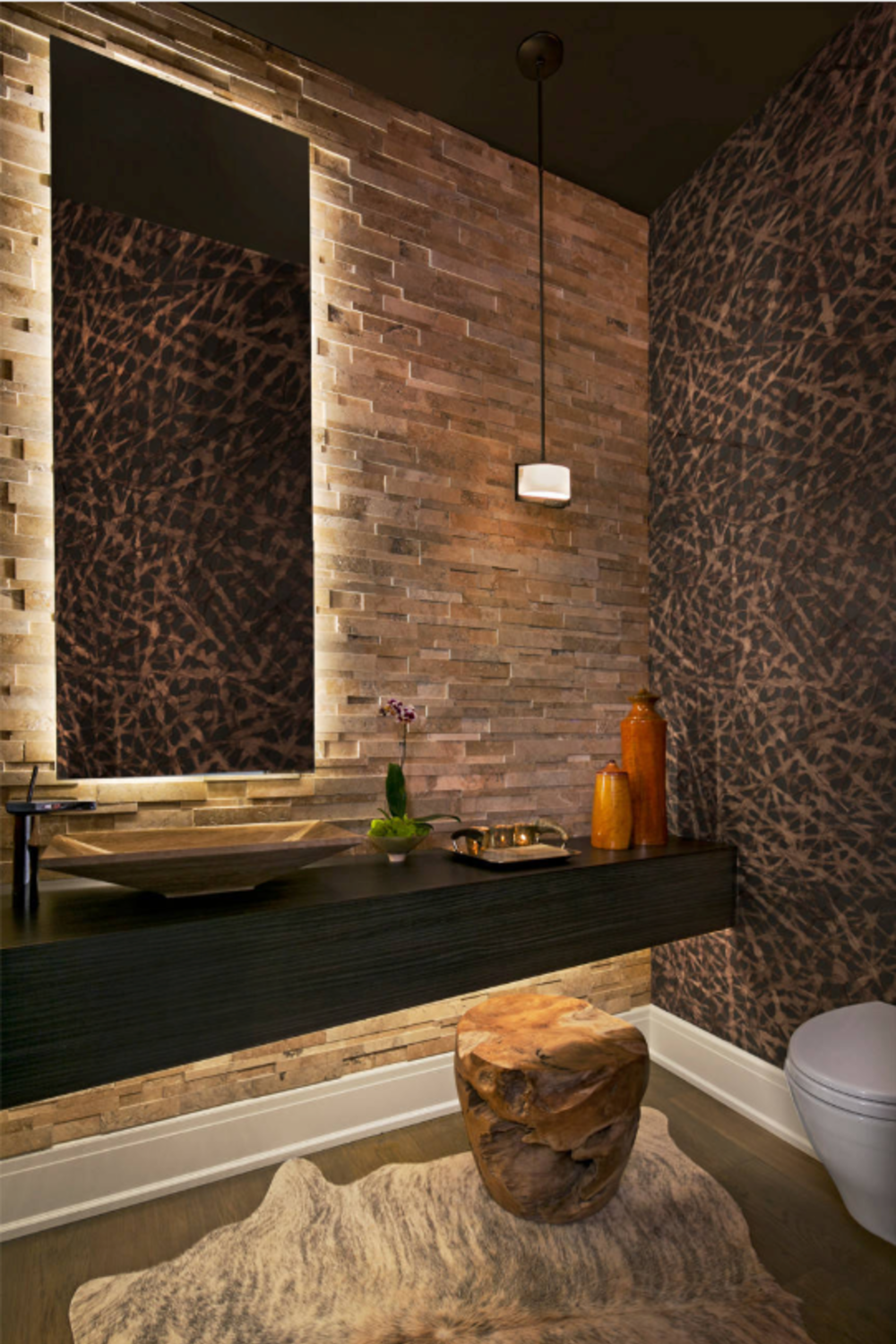 dark brown color tone for bath with exposed mirror and brick wall