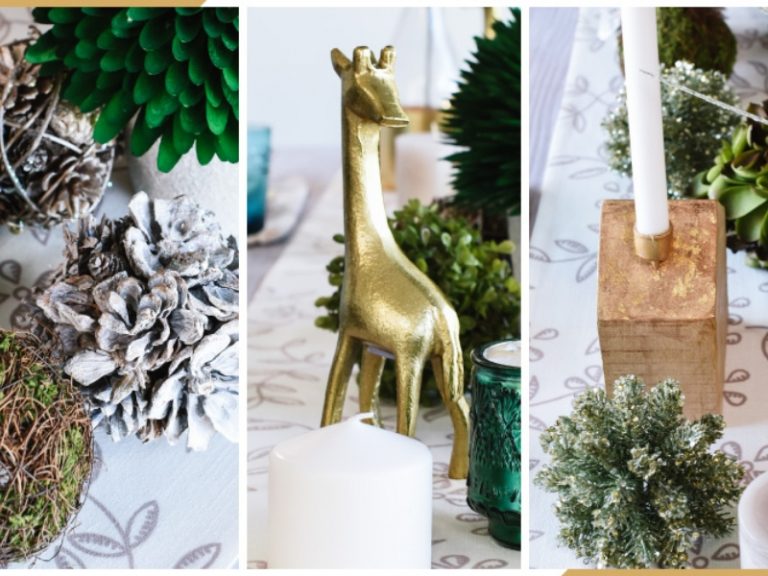 gedeckter Tisch zu Weihnachten mit Tannenzapfen und Moosbällen und goldenen Dekofiguren