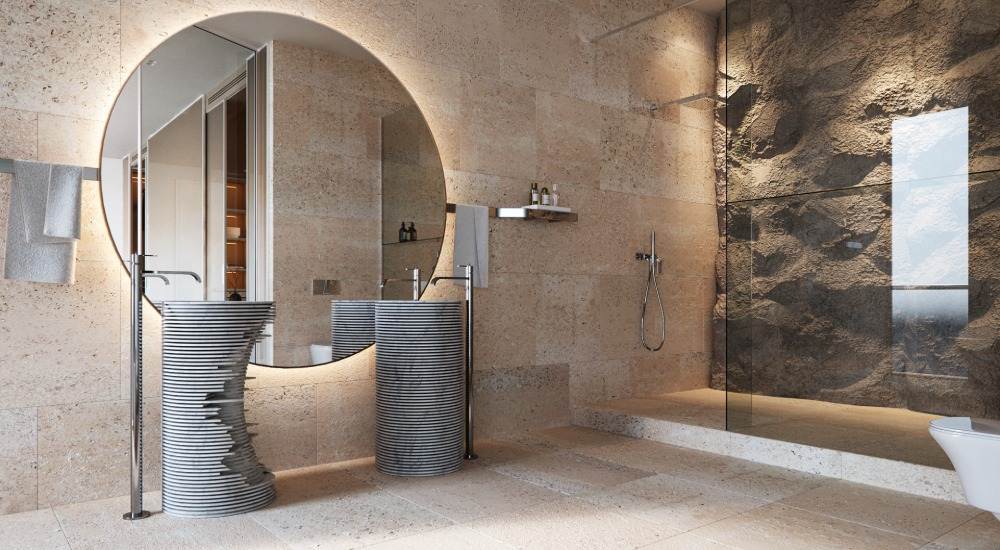 großes badezimmer mit beleuchtetem steinwand im duschbereich