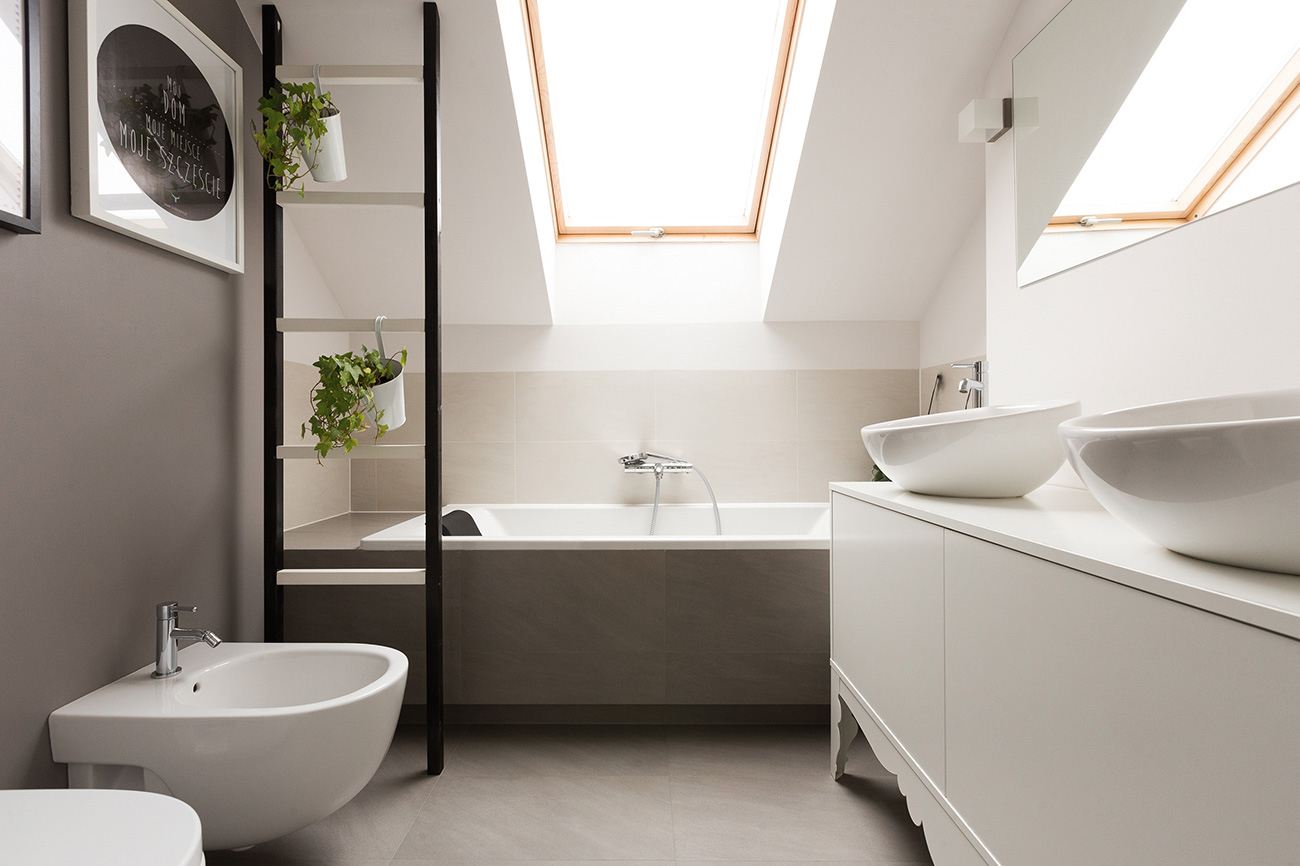 modern baths with roof trusses and tiles in neutral color device with bidet and bath tub