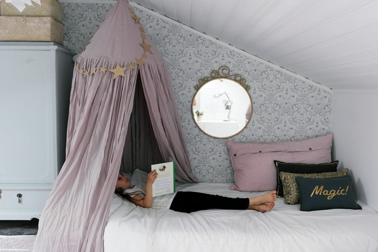 Decorate bed under sloping ceiling with sky and mirror for girls