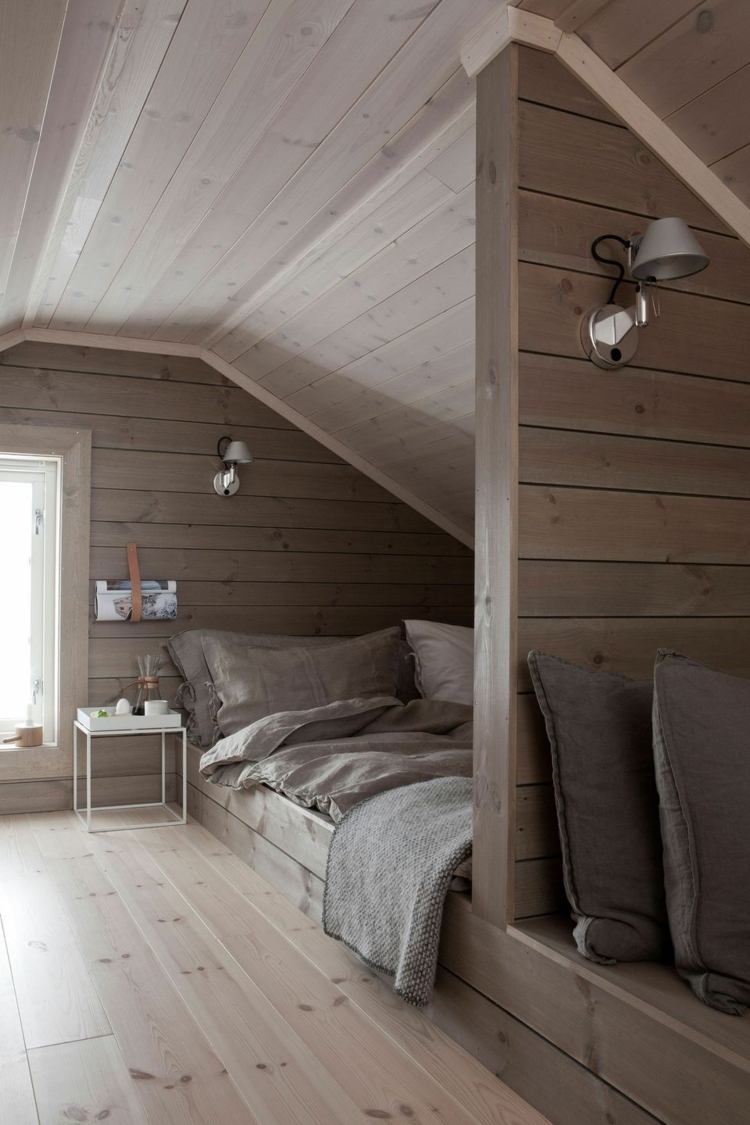 Idea for bed under sloping ceiling in wooden youth room
