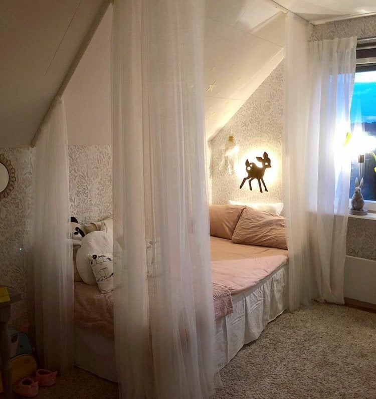 Romantic bed under sloping ceiling for girls with curtains in white