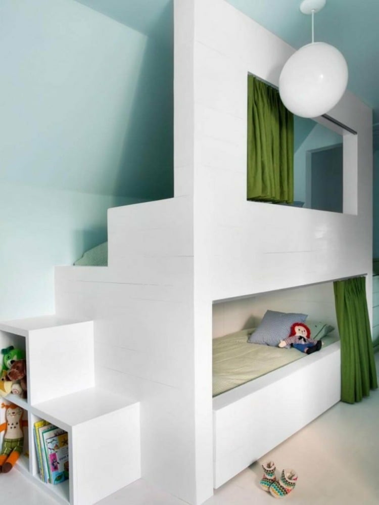 Playful bed design for the slope with window and curtain and guest bed