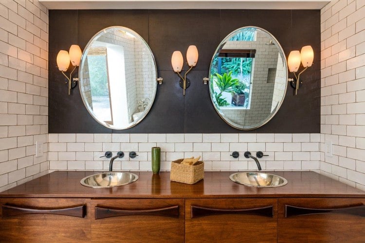 Design a modern Spanish bathroom with a sunken sink and wooden vanity