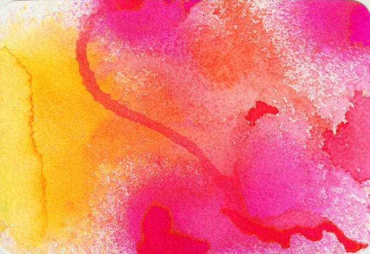 Fröhliche Farben aus Aquarell für ein buntes Bild im Frühling auf Papier sprühen