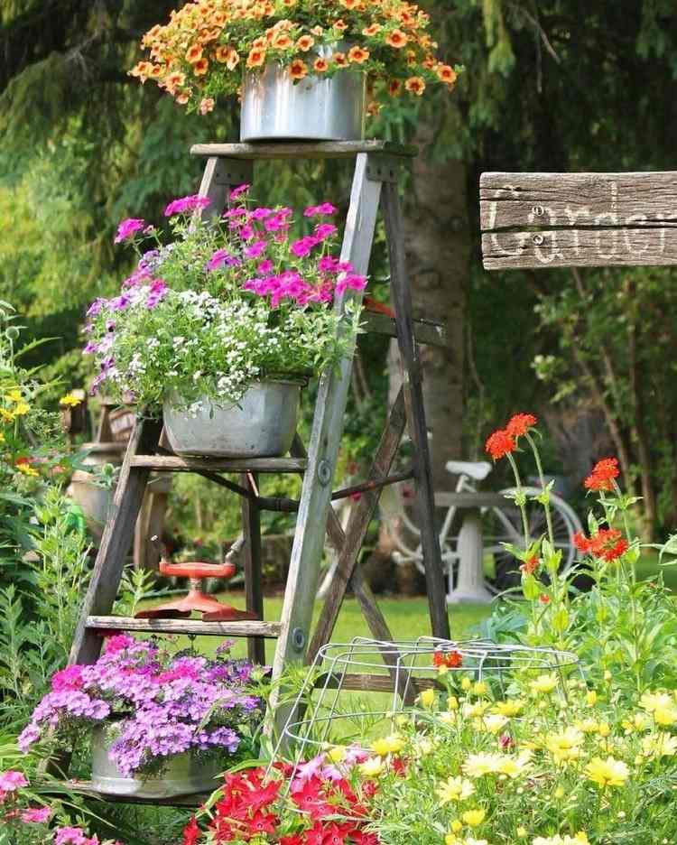 Old buckets in flower pots repurpose ideas for garden decorations for patios and flower beds in the garden
