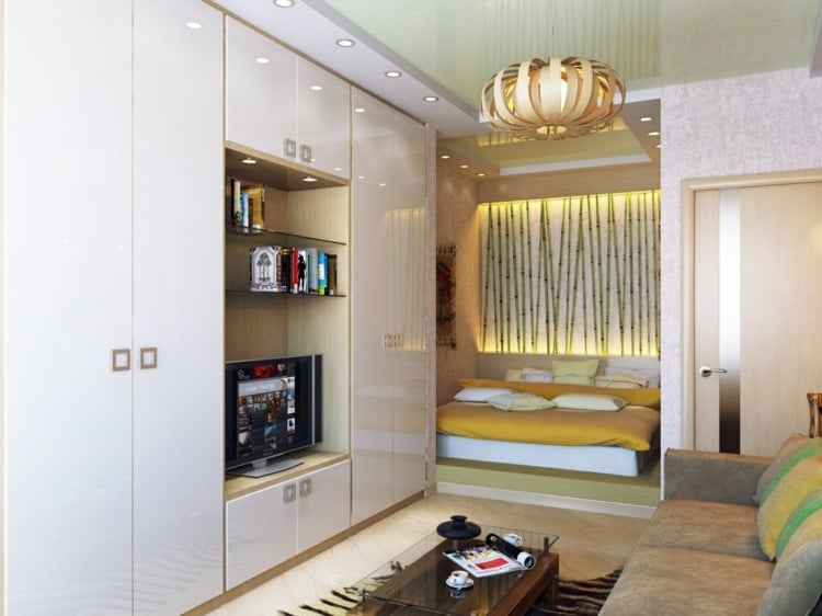 Furnish a one-room apartment - high-gloss wall unit, small sofa and alcove with bed