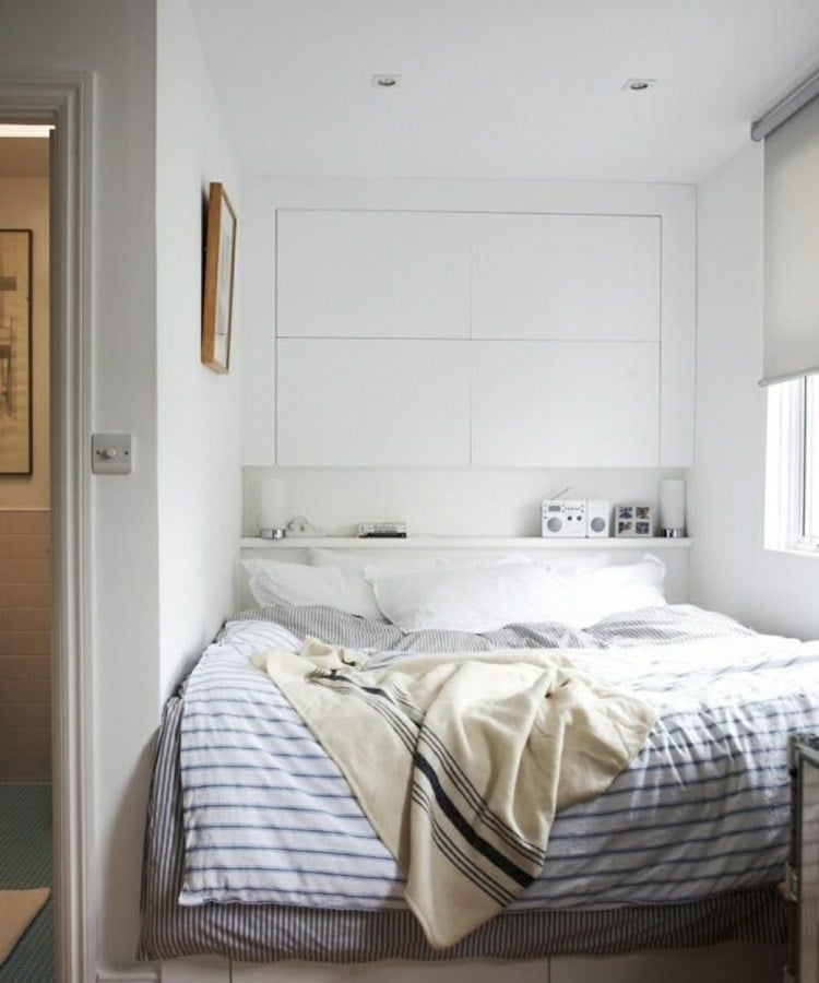 Large bed in a niche with built-in closets