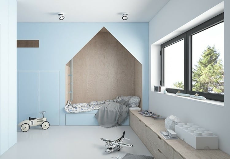 Children's room in light blue and white with a niche for sleeping in the shape of a house