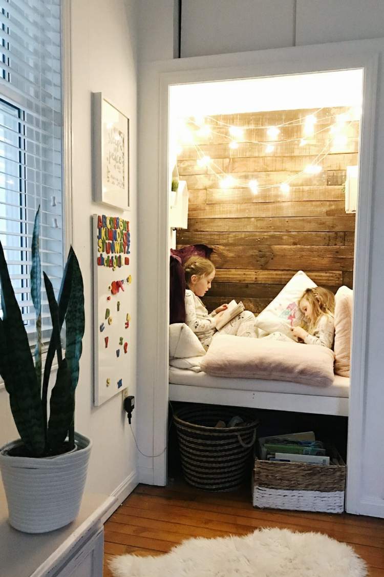 Convert the closet into a reading or sleeping area with fairy lights