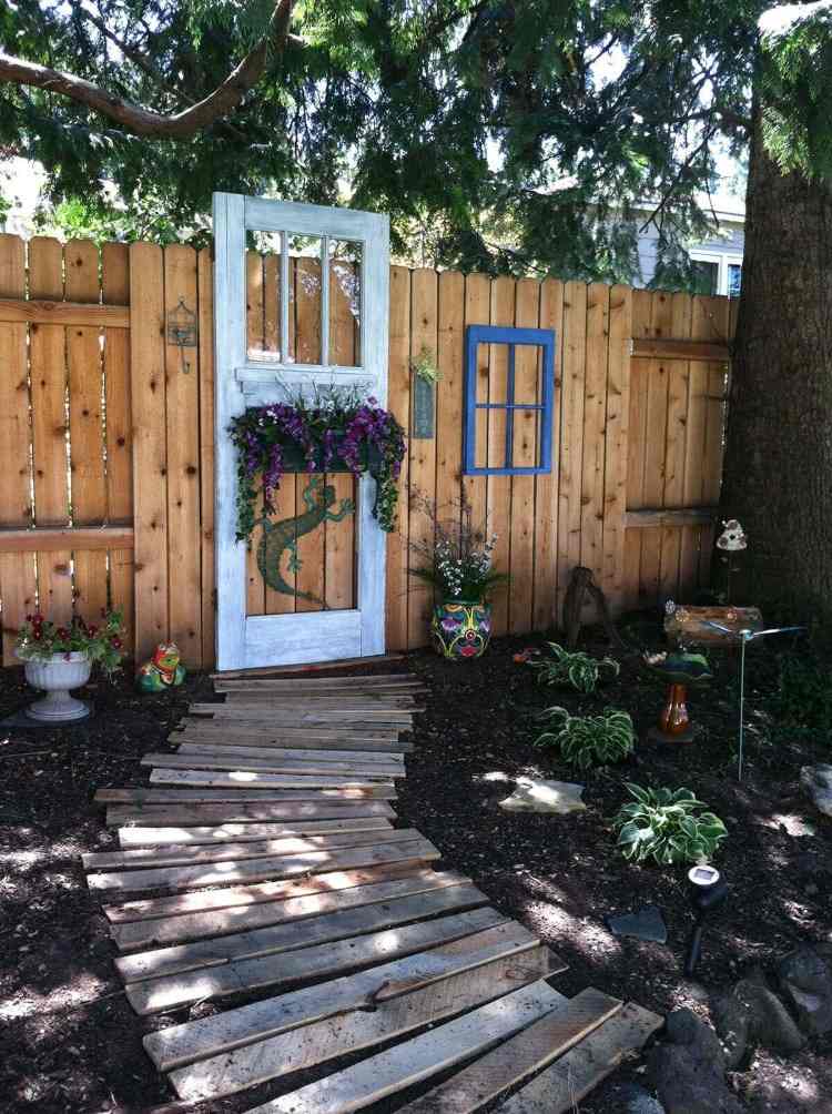 Build your own diy screen and use the old door to make it look modern or rustic with a garden path