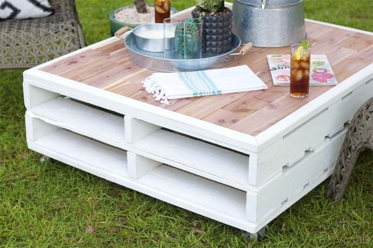 make your own euro pallets painted in white on rolls as a garden table