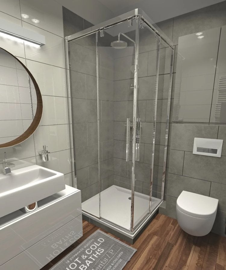 modernes bad in grau mit duschkabine und schrank über wc